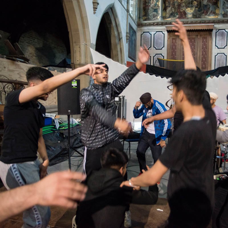 Young adults participating in a music workshop at Mary Magdalene Community Church.